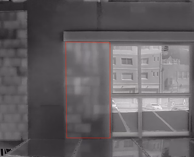 Broad thermal scan of an external wall identifying subsurface concrete defects and moisture patterns.