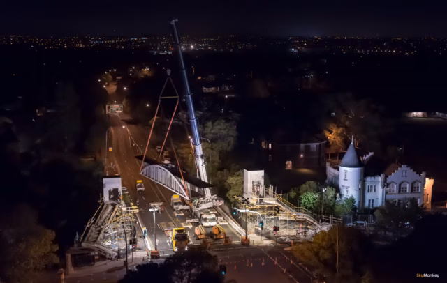 Construction progress of an RMS bridge project shot at night with road closures